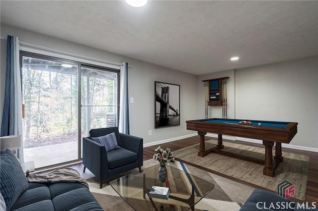 rec room with pool table, a textured ceiling, and wood-type flooring