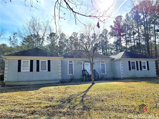 single story home featuring crawl space, stucco siding, and a front yard