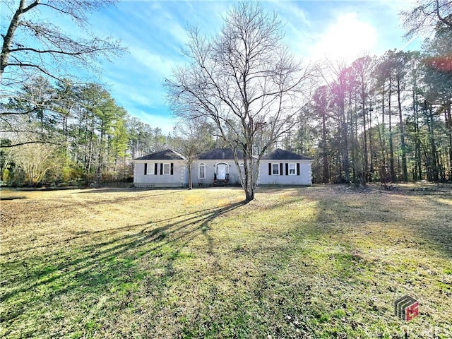 ranch-style house with driveway and a front yard