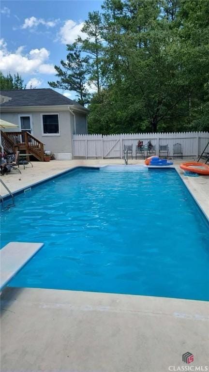 view of pool featuring a fenced in pool, a fenced backyard, and a patio