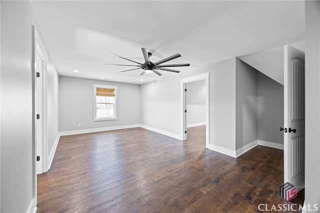 spare room featuring ceiling fan and dark hardwood / wood-style flooring