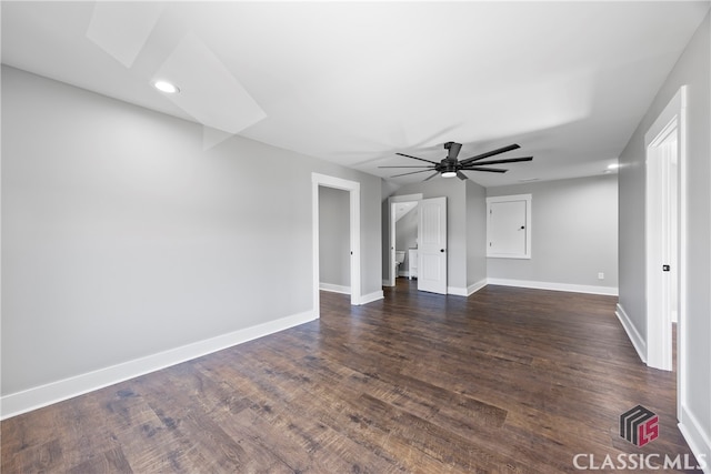 spare room with ceiling fan and dark hardwood / wood-style floors