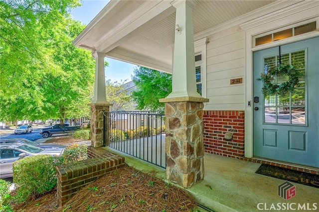 view of exterior entry with a porch