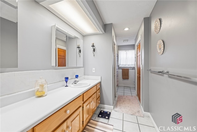 bathroom featuring tile patterned floors and vanity