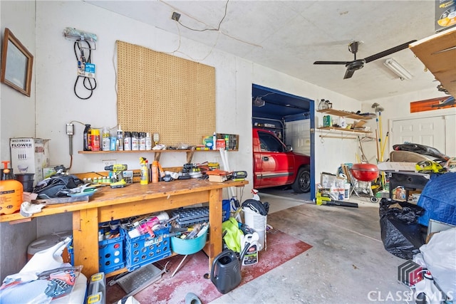 garage with ceiling fan and a workshop area