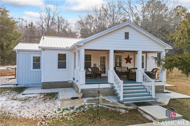 back of house featuring a porch