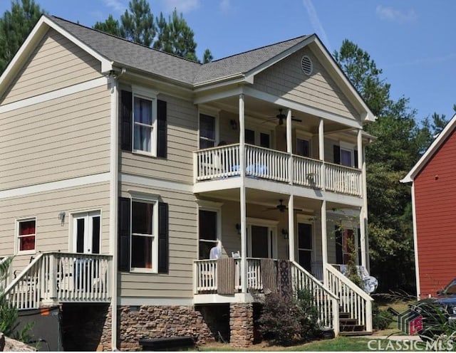 view of front of property with ceiling fan, a porch, and a balcony