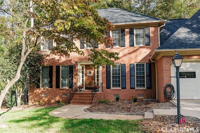 colonial home featuring a garage