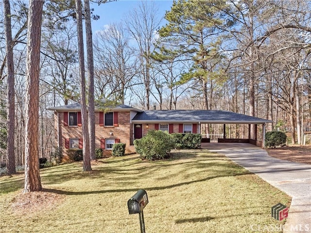 split level home with a carport and a front lawn