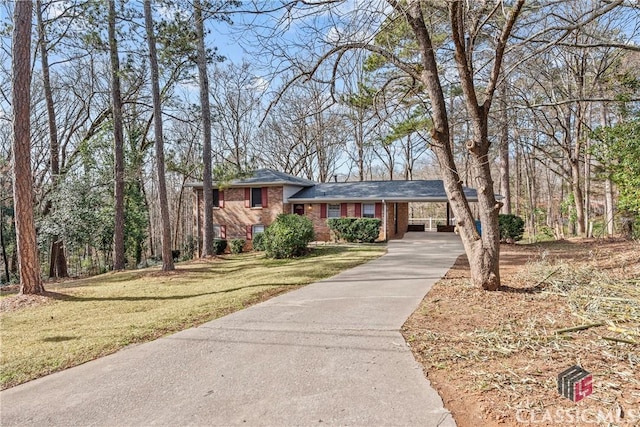 tri-level home with a front yard and a carport