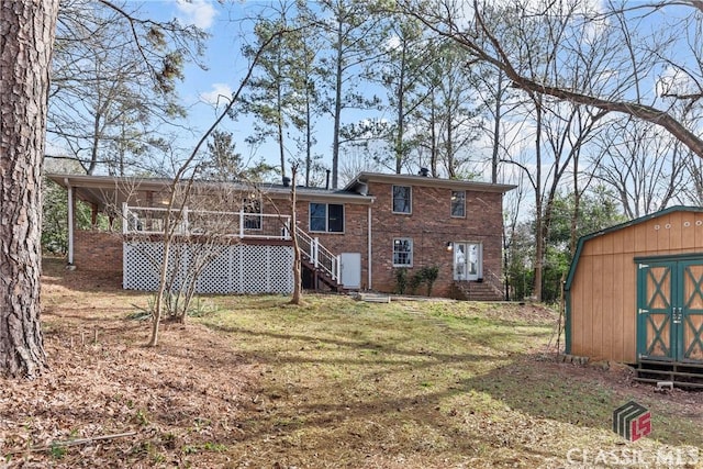 back of house featuring a yard and a storage shed