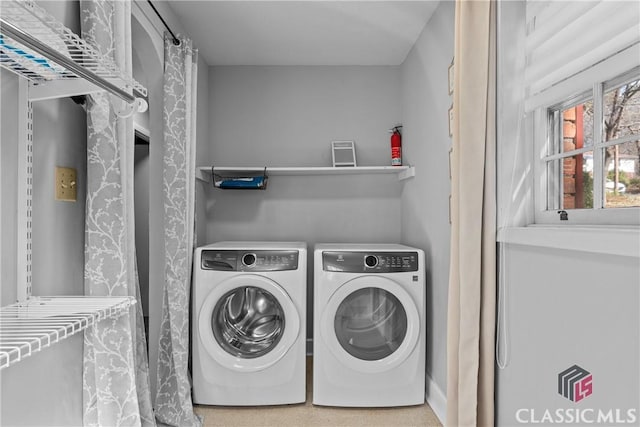 laundry room featuring washer and clothes dryer