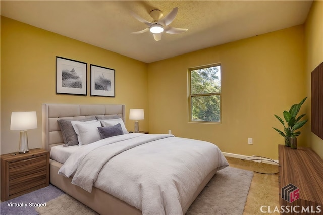 carpeted bedroom featuring ceiling fan