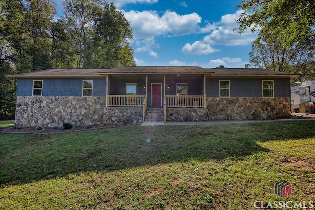 ranch-style house with a porch and a front yard