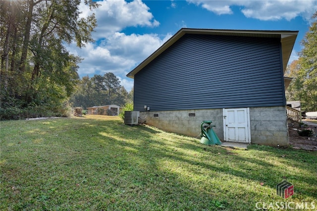 view of property exterior featuring cooling unit and a lawn