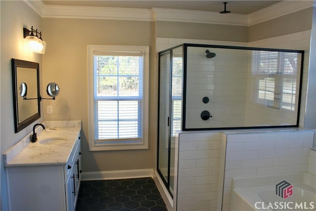 bathroom featuring ornamental molding, tile patterned floors, a healthy amount of sunlight, and vanity