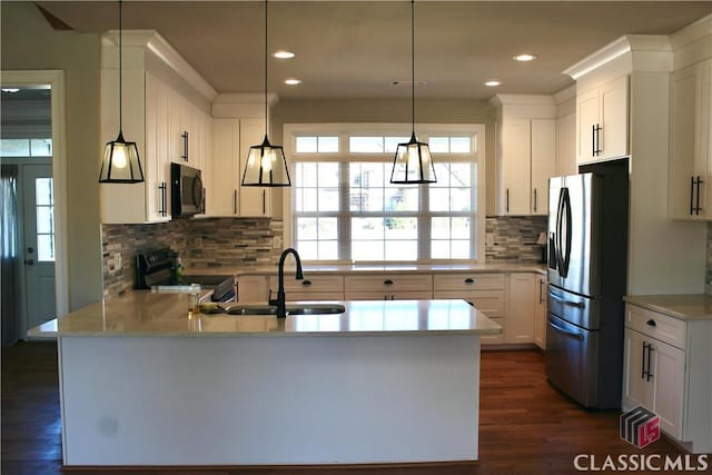 kitchen featuring sink, black range with electric cooktop, white cabinetry, and stainless steel fridge with ice dispenser