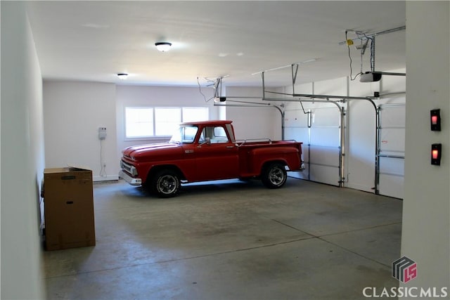 garage featuring a garage door opener