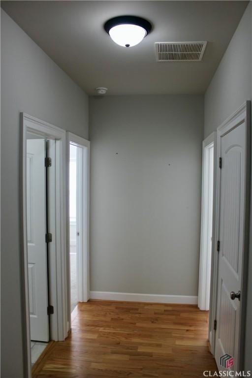 corridor featuring light hardwood / wood-style floors