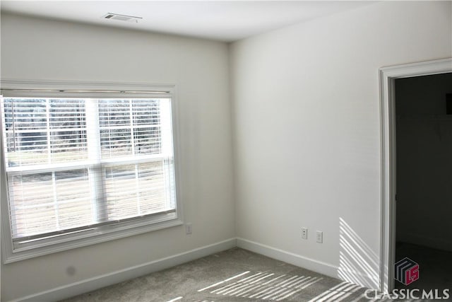 empty room featuring carpet flooring