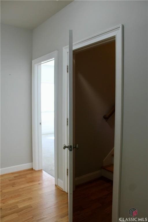 corridor featuring hardwood / wood-style flooring