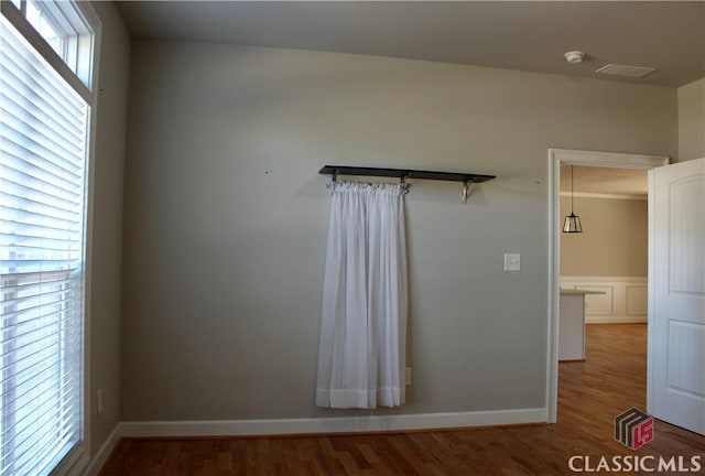 spare room featuring wood-type flooring