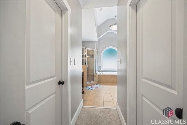 hallway with light tile patterned floors