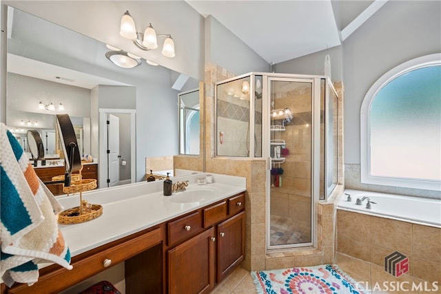 bathroom with independent shower and bath, tile patterned floors, and vanity