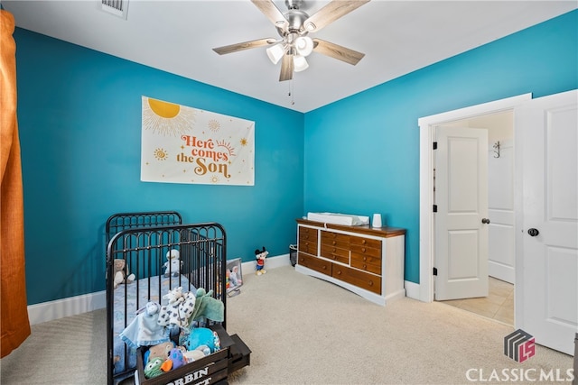 carpeted bedroom featuring ceiling fan