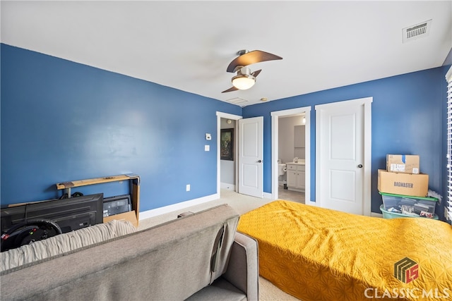 carpeted bedroom featuring ceiling fan and connected bathroom