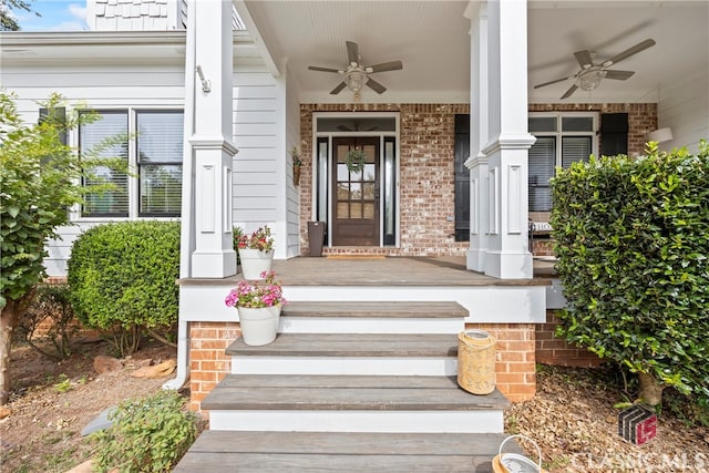 doorway to property with ceiling fan and a porch