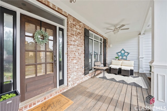 wooden deck featuring ceiling fan and covered porch