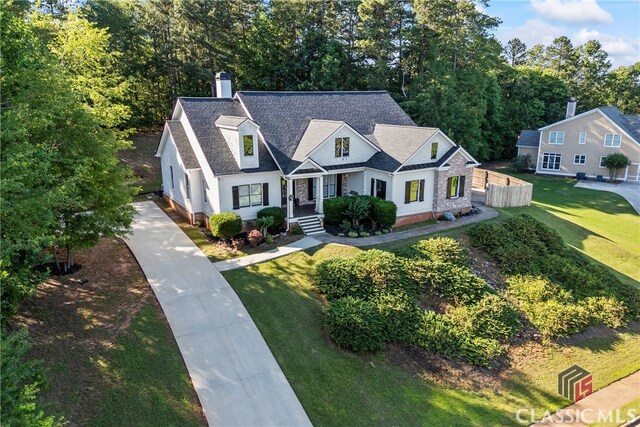 189 Bear Cub, Bogart, GA 30622 - view of front of home with a chimney, driveway, and roof with shingles