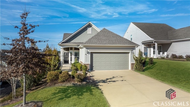 view of front of home featuring a front lawn and a garage