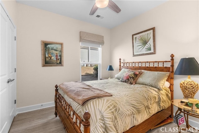 bedroom featuring ceiling fan and hardwood / wood-style flooring