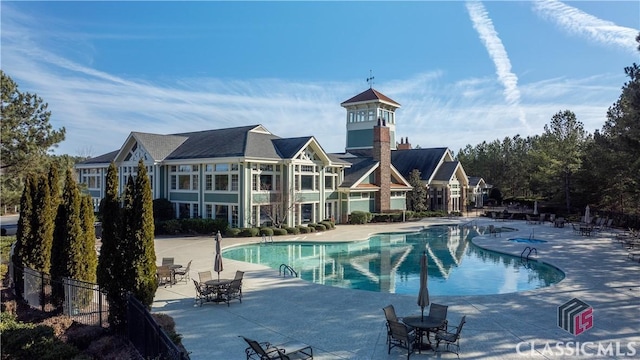 view of swimming pool with a patio area