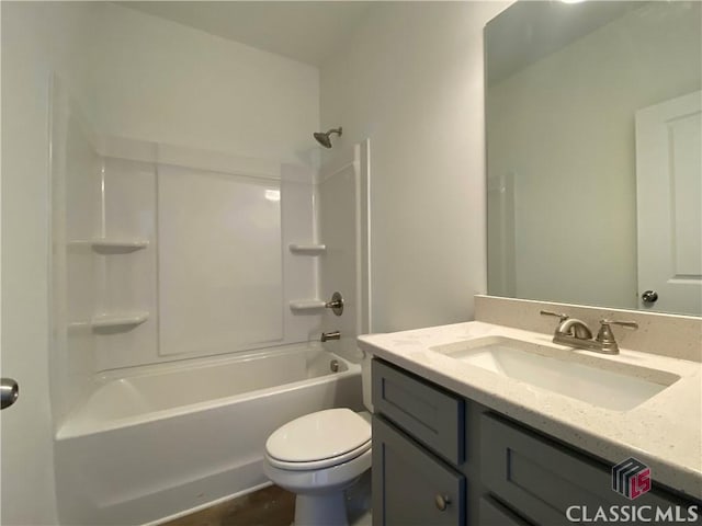 full bathroom featuring wood-type flooring, toilet, vanity, and bathing tub / shower combination