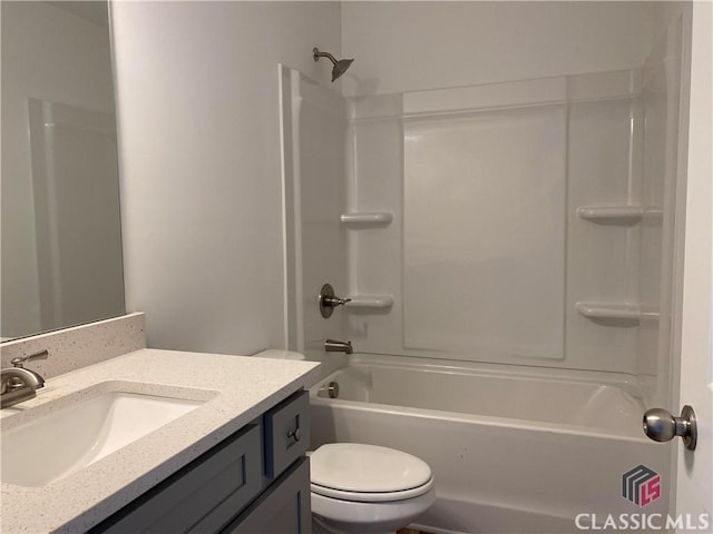 full bathroom with toilet, vanity, and shower / bathtub combination