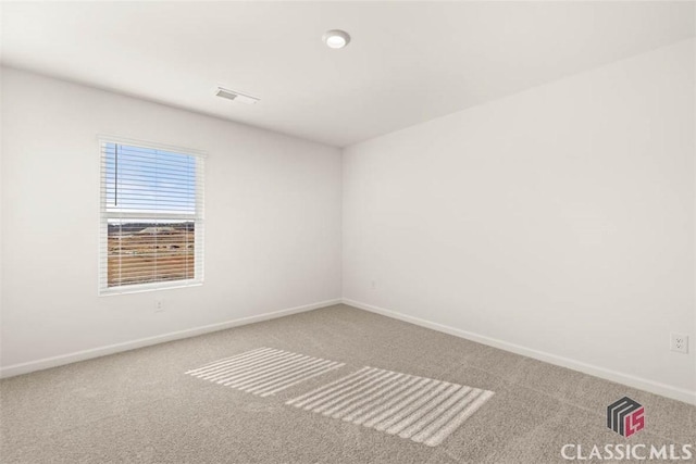 empty room featuring carpet floors