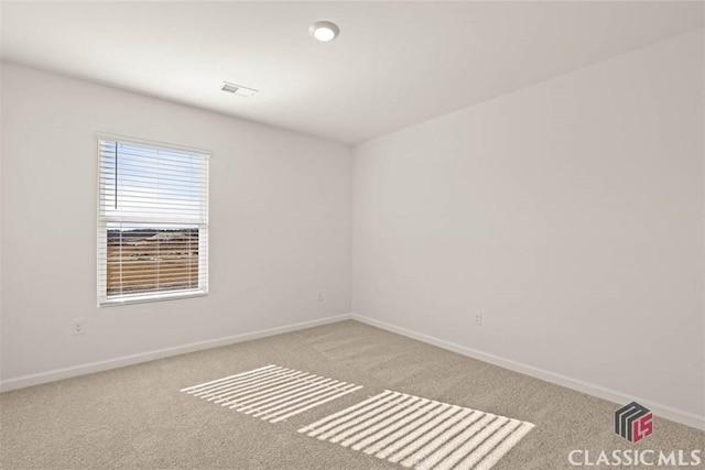 unfurnished room with light colored carpet