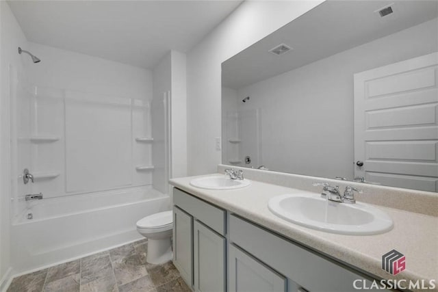 full bathroom featuring shower / tub combination, vanity, and toilet