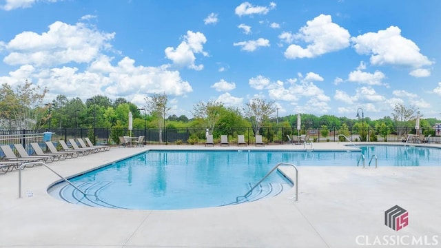 view of swimming pool featuring a patio