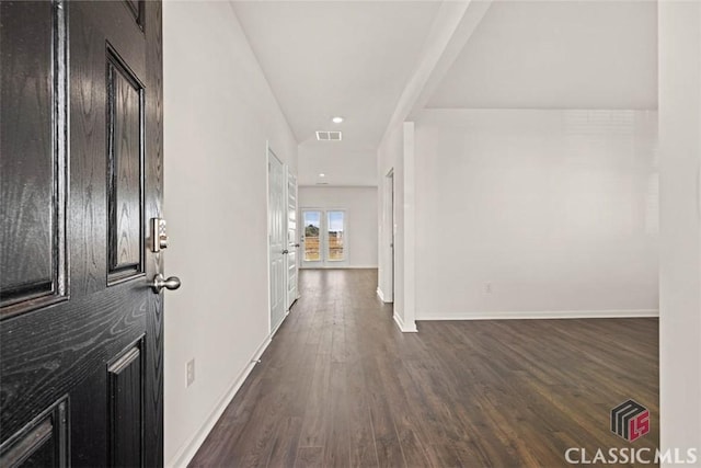 corridor featuring dark wood-type flooring