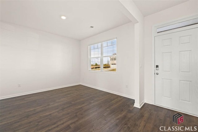 foyer entrance featuring dark hardwood / wood-style flooring