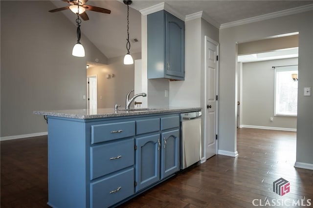 kitchen with stainless steel dishwasher, sink, blue cabinetry, and pendant lighting