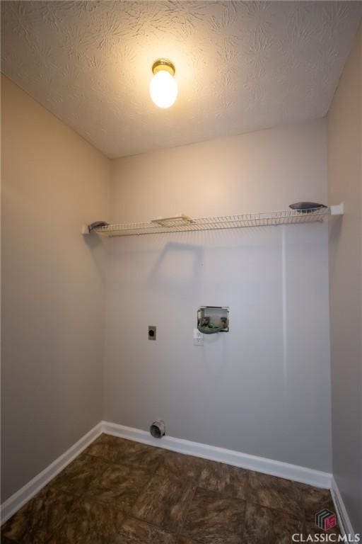 laundry room featuring washer hookup, a textured ceiling, and hookup for an electric dryer