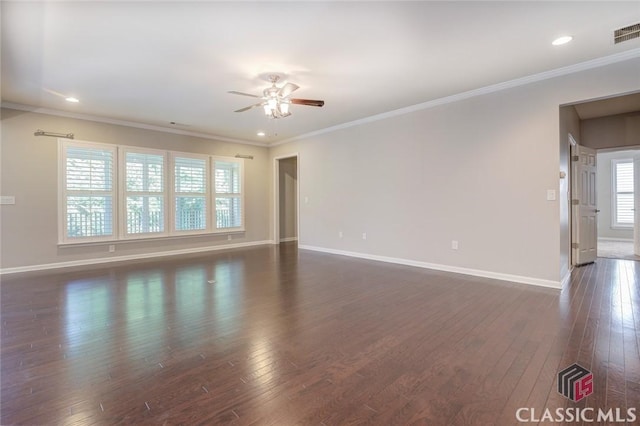 unfurnished room featuring ceiling fan, a wealth of natural light, and crown molding