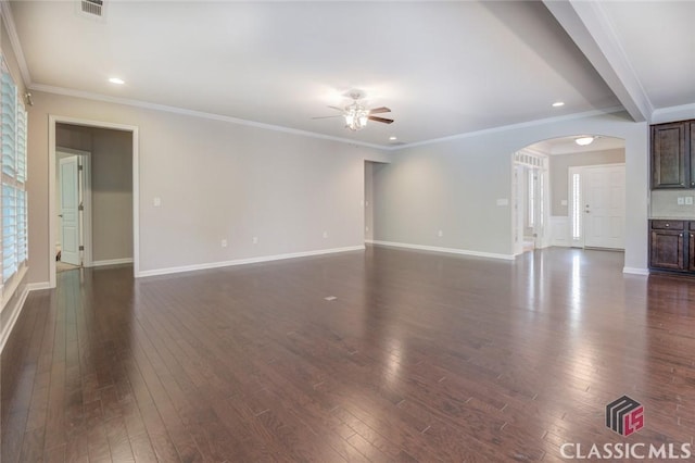 unfurnished living room with ceiling fan, dark hardwood / wood-style floors, and ornamental molding