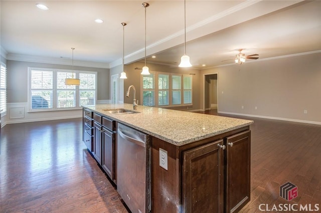 kitchen with decorative light fixtures, a kitchen island with sink, stainless steel dishwasher, and sink