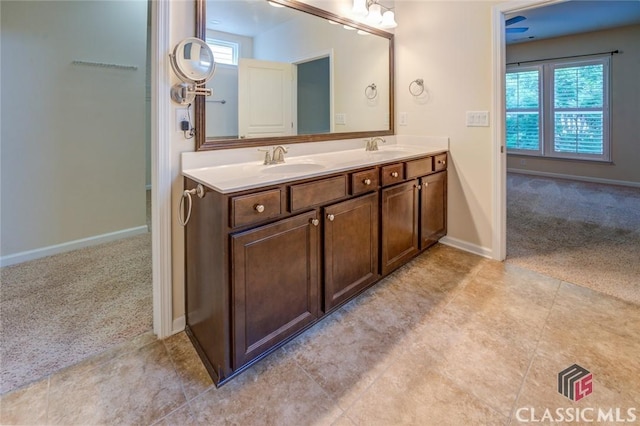 bathroom with a healthy amount of sunlight and vanity